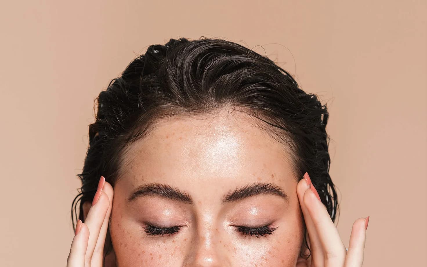 Close-up of a woman’s perfectly shaped and defined eyebrows, highlighting the precision and artistry of microblading.